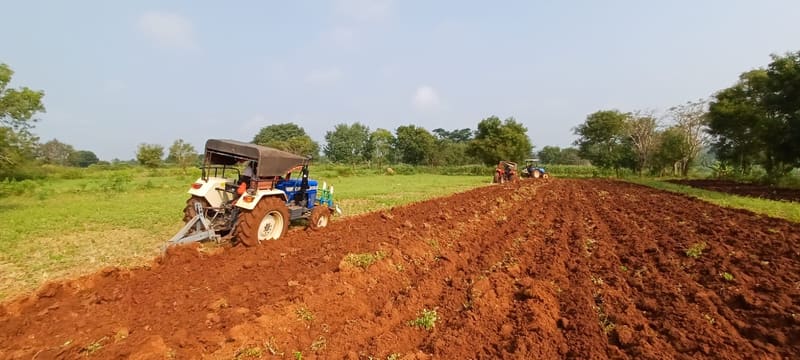 Tractors ploughing the parcel ahead of a new cycle
